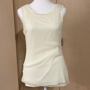 Banana Republic size small cream color sleeveless blouse.